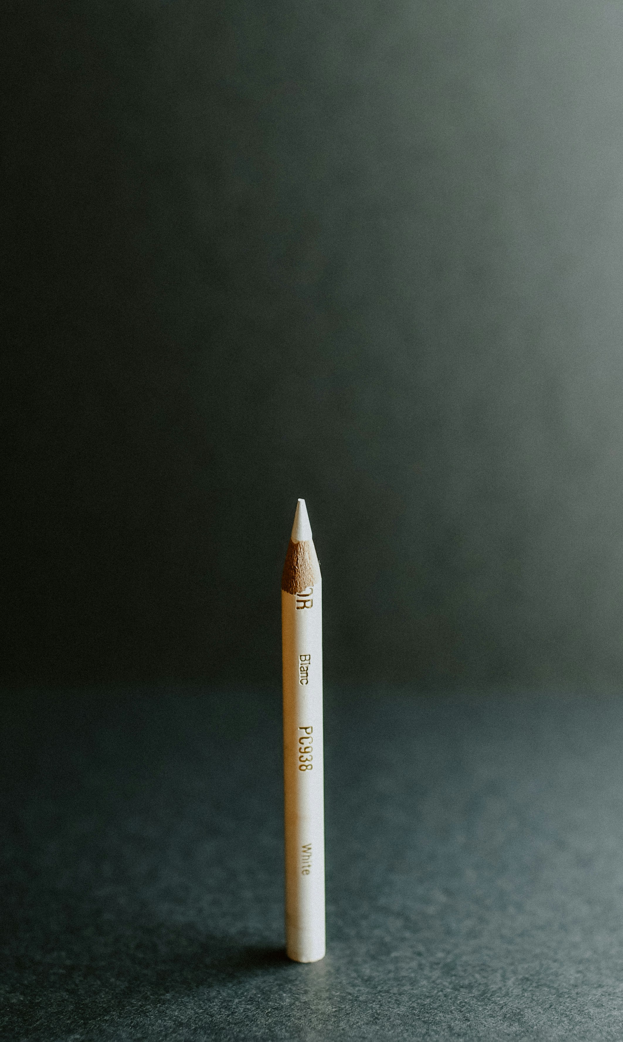 white and gray pen inside well lit room